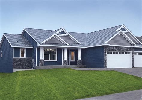 tan house with blue metal roof|blue roof exterior home.